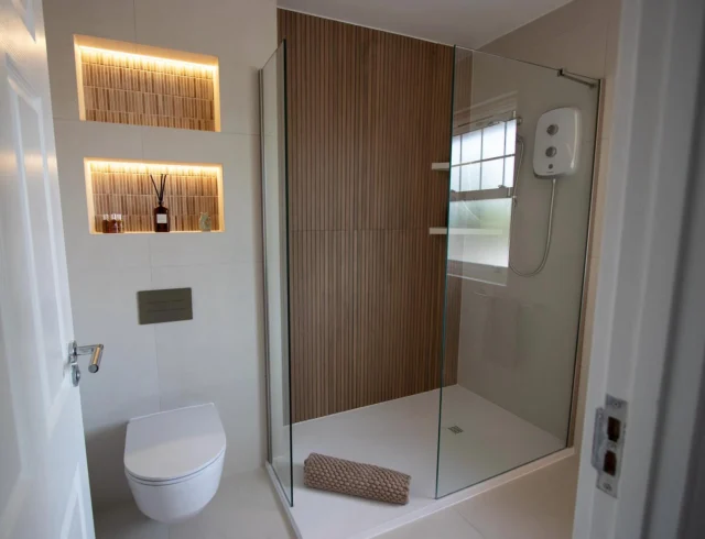 Warm neutrals & natural textures 🤎

This recent bathroom renovation was all about creating a calm, contemporary space through a considered mix of texture, tone and lighting. (Swipe to see the before!)

The wood-effect tiled feature wall adds warmth and texture, paired with a floating vanity in a natural oak finish. Illuminated mosaic niches add a soft layer of lighting, while the neutral tiled backdrop keeps the overall scheme light and understated.

Designed, supplied and installed by our in-house team.

Thinking about transforming your bathroom? Get in touch with our team today:

📞 01959 523 008
🌐 https://www.olympusbathrooms.co.uk/
 📧 info@olympusbathrooms.co.uk

#neutralbathroom #calmbathroom #luxurybathroom #bathroomdesign #beforeandafter