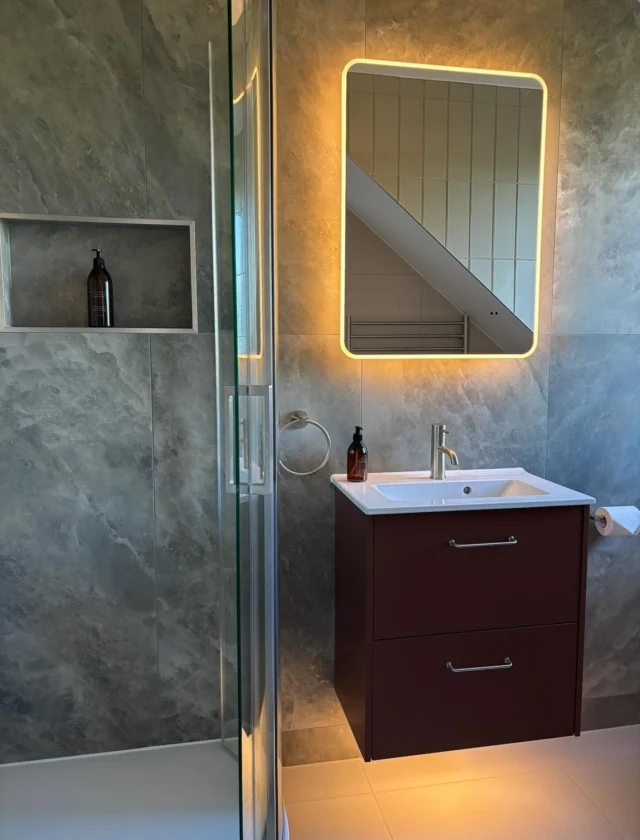 An en suite rich in colour and texture ✨

We loved creating this space. The deep earthy red vanity unit pairs perfectly with the green textured tiles.

Our favourite detail? The mosaic tiling around the curve of the shower tray, adding another layer of colour and texture.

Brushed nickel finishes and ambient lighting from the mirror and beneath the vanity bring it all together with a warm glow.

Designed, supplied and installed by our in-house team.

Thinking about transforming your own space? Get in touch with our team today:

📞 01959 523 008
🌐 https://www.olympusbathrooms.co.uk/
 📧 info@olympusbathrooms.co.uk

#greenensuite #redensuite #ensuitedesign #ensuiteinspo #luxurybathroom